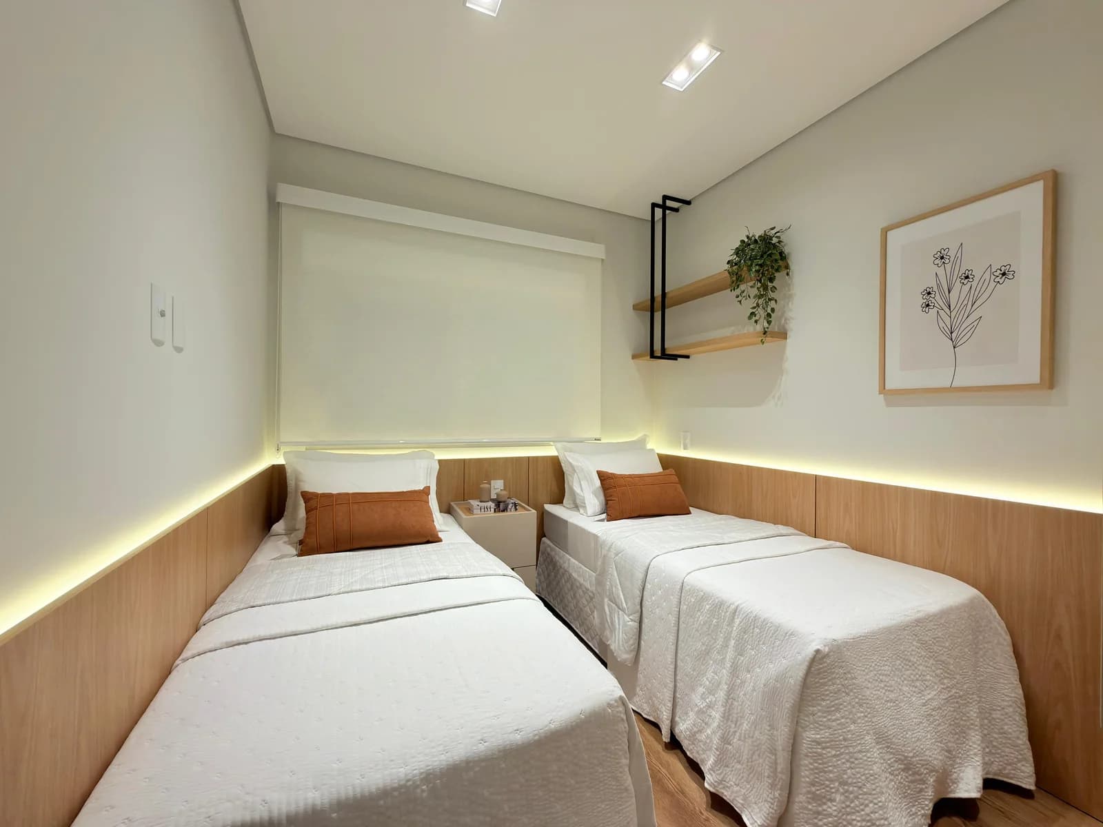 Segundo dormitório do apartamento 602, com duas camas de solteiro.