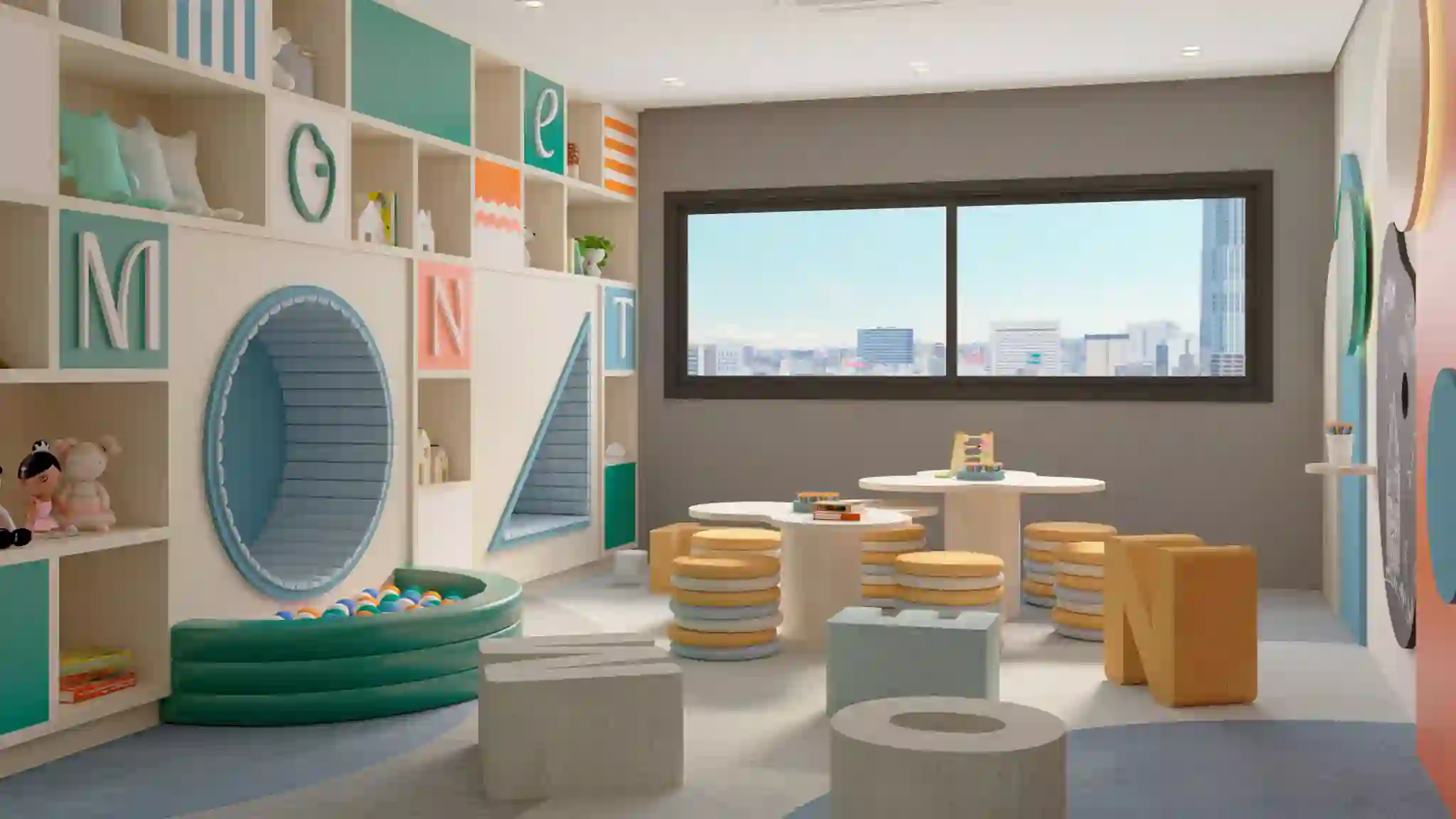 Espaço kids decorado, com piscina de bolinhas e mobiliário lúdico.