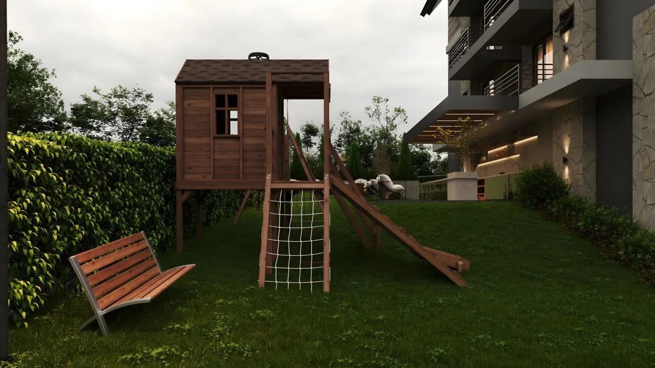 Perspectiva do playground de madeira no gramado.