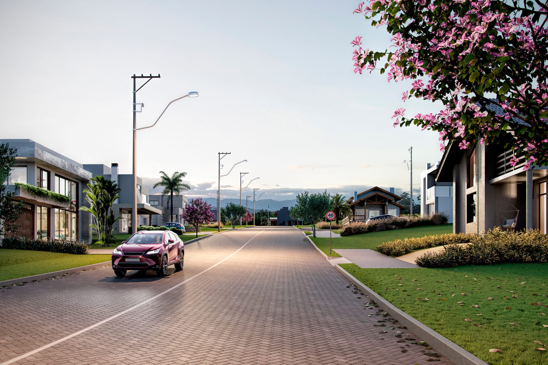 Rua pavimentada do loteamento com casas, árvores e iluminação em LED (imagem ilustrativa do projeto)