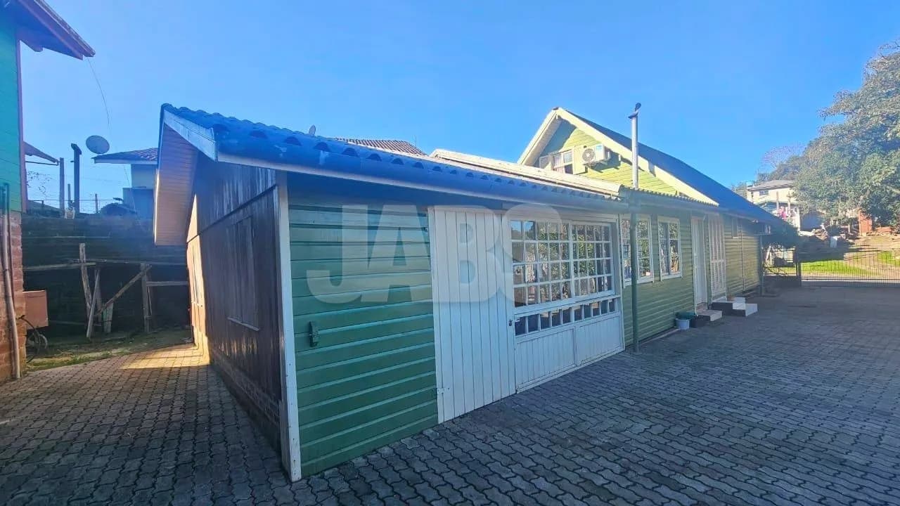 Terreno com 2 casas alugadas na Vila do Cedro, foto 1