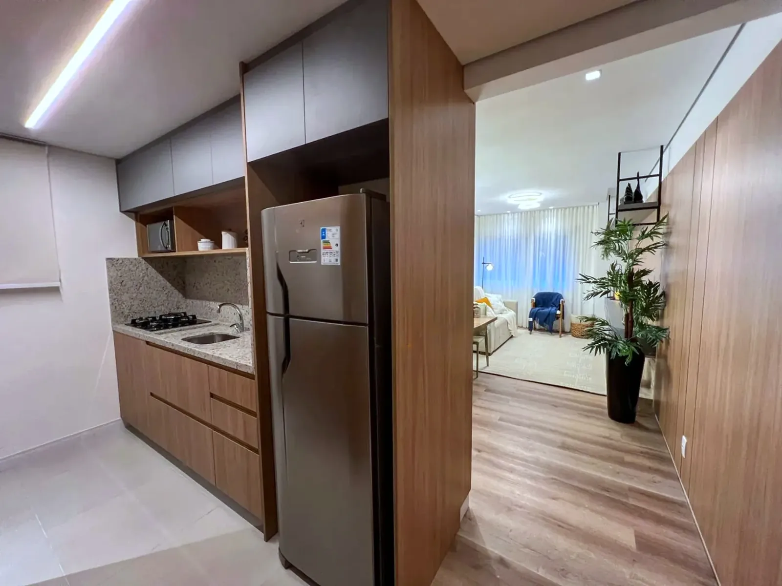 Cozinha planejada aberta para o living