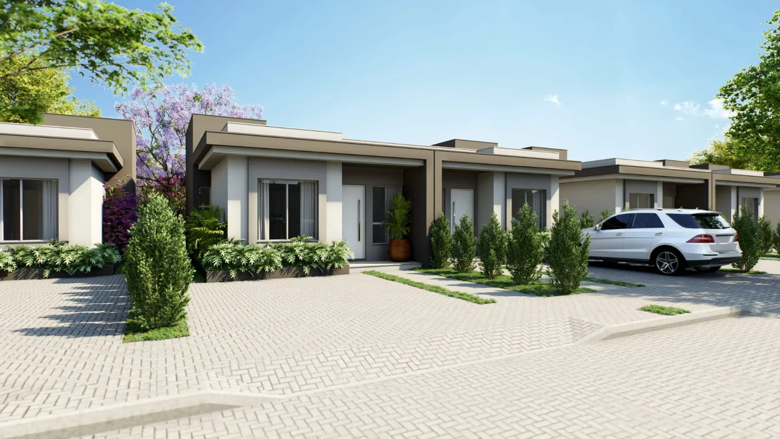 Projeto das casas térreas do Vale dos Plattanos, com fachada clara, jardim na frente e vaga de garagem.