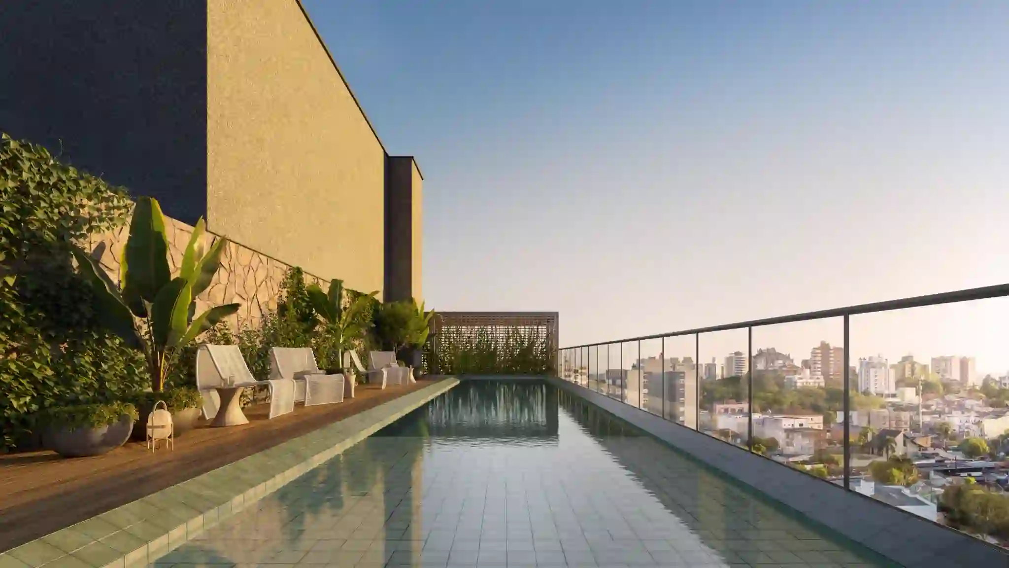 Piscina de raia no rooftop, com deck de madeira e vista para o centro de Canoas.